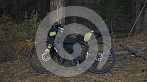 The mixed terrain cycle touring bike with bikepacking. The trip on multitrack bike, outdoor road in mountain snow capped