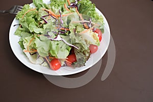 mixed vegetable salad organic on white dish
