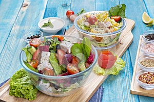 Mixed Vegetable Salads on Blue Wood Background - Mixed Gourmet Food , Mixed Healthy Food - Chicken Salad / Cheese Salad - Green photo