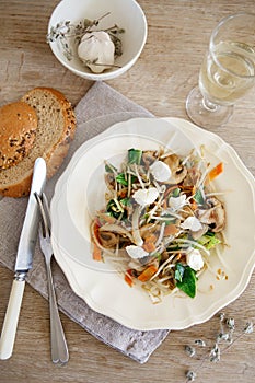 Mixed vegetable stir fry with mushrooms and cottage cream cheese. Tender mushroom stir fry served in a white plate with white wine