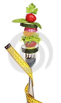 Mixed vegetables on a fork isolated.