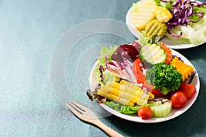 Mixed vegetables salad with wooden fork