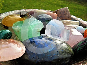 Mixed vibrant and colorful crystal stones in a bowl