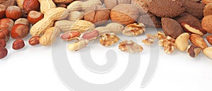 Mixed whole and shelled nuts in a banner photo