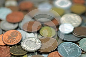 Mixed world currency coins, Swiss Franc in focus