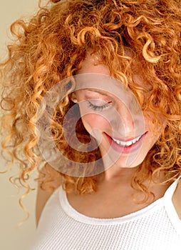 Mixed young woman with curly hair