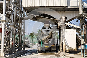 Mixer concrete trucks waiting to load concrete mixing at batching factory for go to the casting place on building site