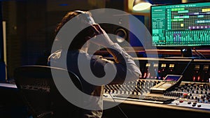 Mixer producer develops audio by editing recordings and integrating sounds photo
