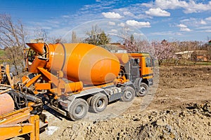 Mixer truck at the construction site, pouring to pump for concrete