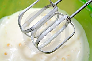 Mixer Whisks and Whipped Eggs in Bowl