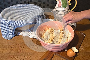 mixing a cake in a traditional bowl