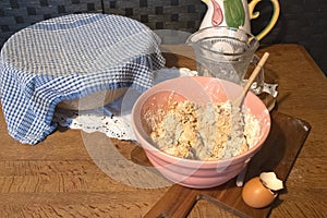 mixing a cake in a traditional bowl