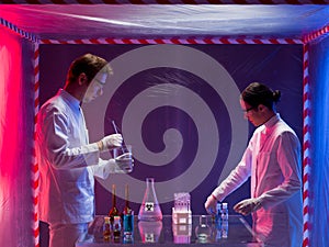 Mixing chemicals in a containment tent photo