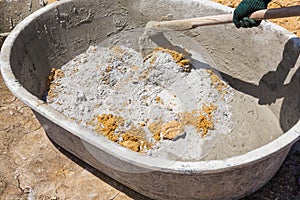 Mixing concrete in tub
