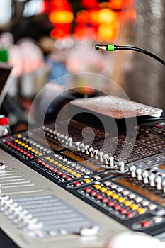 Mixing console of light equipment operator at the concert. Sound recording studio mixing desk with engineer or music