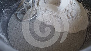 Mixing construction filler in a bucket. Mixing of a plaster. Worker mixing plaster in a bucket for alignment and putty walls of