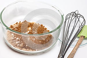 Mixing dry ingredients to prepare integral wheat bran muffins