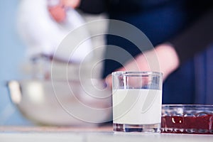 Mixing egg cream with motor mixer, baking cake