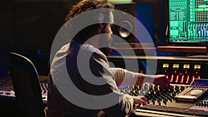 Mixing engineer focuses on blending and balancing individual tunes of a recording