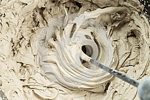 Mixing of filler in a bucket