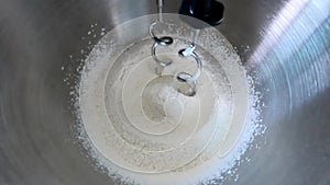 Mixing flour ingredient in stand mixer for making bakery, bread and cake. Prepare dough for baking with flour mixing machine.