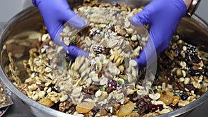Mixing homemade muesli with nuts and fruits