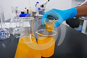 Mixing liquids in a sterile environment at a chemistry lab