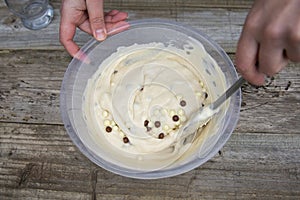 Mixing raw dough in bowl. Baking cake, muffin or homemade pastry