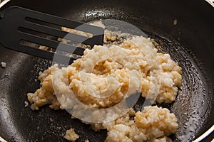 Mixing rice with soy sauce