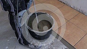 Mixing tile adhesive or cement with power drill tool