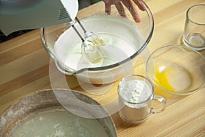 Mixing wiped cream, making delicious cream for cupcake photo