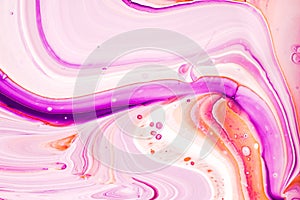 Mixture of acrylic paints. Modern artwork with spots and splashes of color paint. Liquid marble texture. Applicable for