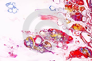 Mixture of acrylic paints. Modern artwork with spots and splashes of color paint. Liquid marble texture. Applicable for