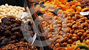 Mixture of dates dry fruits Raisins and nuts in the market La Boqueria in Barcelona,Spain