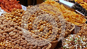 Mixture of dates dry fruits Raisins and nuts in the market La Boqueria in Barcelona,Spain