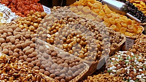 Mixture of dates dry fruits Raisins and nuts in the market La Boqueria in Barcelona,Spain