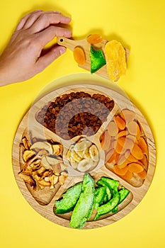 Mixture of dried fruits. Symbols of the Jewish holiday Tu Bishvat. Thanksgiving Day. Flat lay, top view