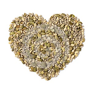 Mixture of dried salad seeds in heart shape isolated on white background