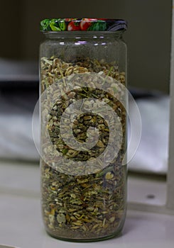 A mixture of feed for Georgians in a jar. Ready-made food for rodents from plant seeds and vitamins. Production food for photo