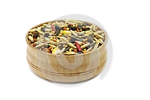A mixture of grains and cereals in a wooden cup
