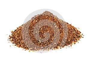 Mixture of ground peppers on white background