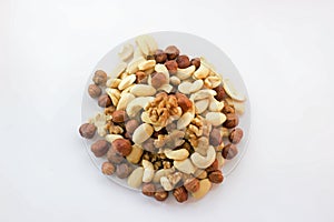 Mixture hazelnuts almonds walnuts cashews on pile