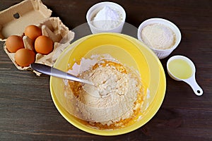 Mixture in Mixing Bowl and with Another Ingredients for Baking Whole Wheat Cake photo