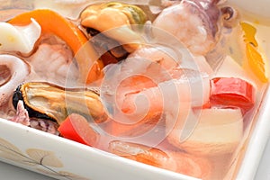 Mixture of molluscs and seafruit in oil