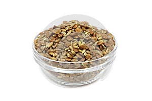 A mixture of raw grain cereals in a glass cup