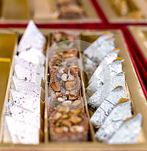 A mixture of various Indian sweets packed in a box. Peda, laddu, mithai, diwali sweets