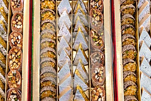 A mixture of various Indian sweets packed in a box. Peda, laddu, mithai, diwali sweets