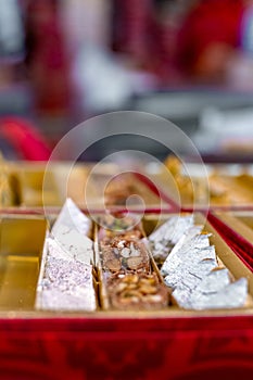 A mixture of various Indian sweets packed in a box. Peda, laddu, mithai, diwali sweets