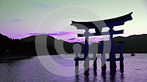 Miyajima floating torii in purple light