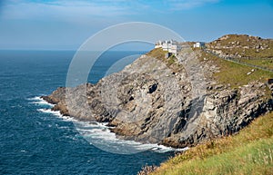 Mizen Head Signal Station lighthouse with dramatic rocky coastline in the Atlantic ocean . County Cork, Ireland.